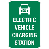 This is a rectangle shape sign with white text saying electric vehicle charging station on a green background. This sign can be reflective or non-reflective. 