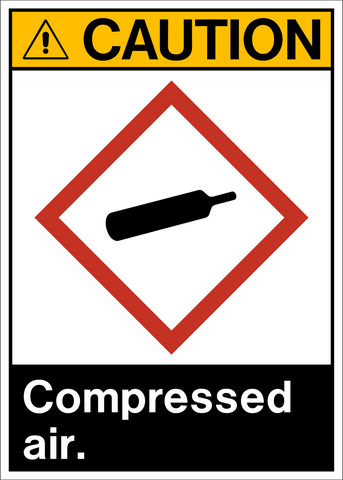 A safety sign with a yellow background and the text 'CAUTION COMPRESSED AIR.' It features a red diamond-shaped sign with a white symbol representing a compressed air cylinder and the word 'AIR' below it.