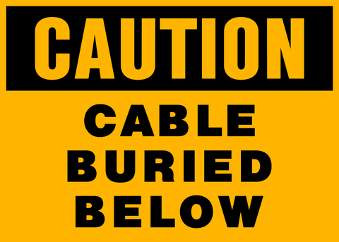 Yellow sign with black text 'CAUTION CABLE BURIED BELOW'.