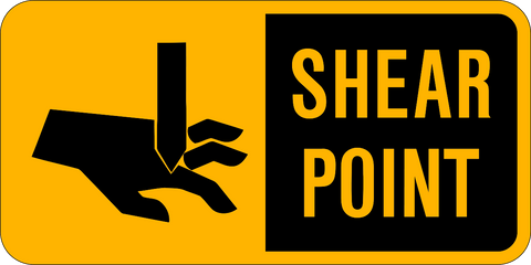 Yellow safety sign with black pictogram and text indicating 'CAUTION SHEAR POINT'.