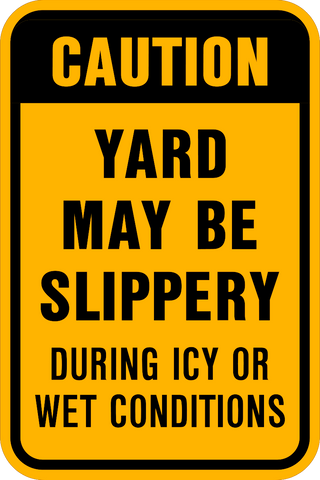 A yellow and black caution sign with text warning that the yard may be slippery during icy or wet conditions.