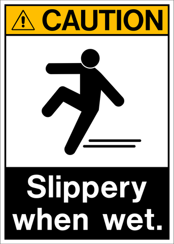 A rectangular sign with a black and white pictogram of a person slipping on a wet surface, and the text 'CAUTION SLIPPERY WHEN WET.'.