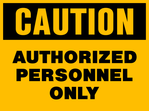 A yellow sign with black text saying 'CAUTION AUTHORIZED PERSONNEL ONLY'.
