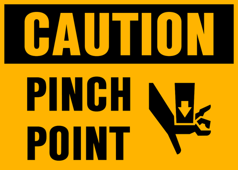 A yellow safety sign with black and white text and pictogram indicating a 'Caution Pinch Point'.