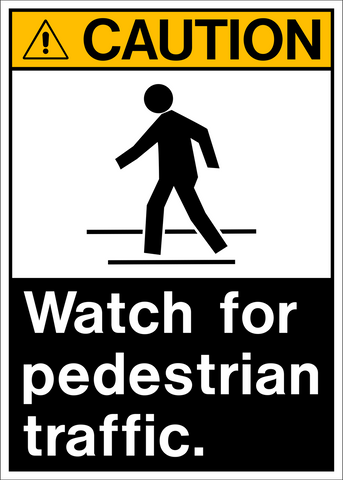 A black and white sign with a pictogram of a person walking and the text 'CAUTION WATCH FOR PEDESTRIAN TRAFFIC.'