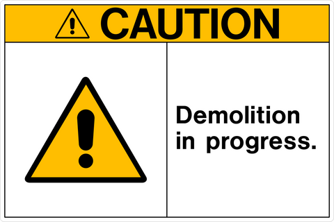 A safety sign with a yellow background and black and red text that reads 'CAUTION DEMOLITION IN PROGRESS.'