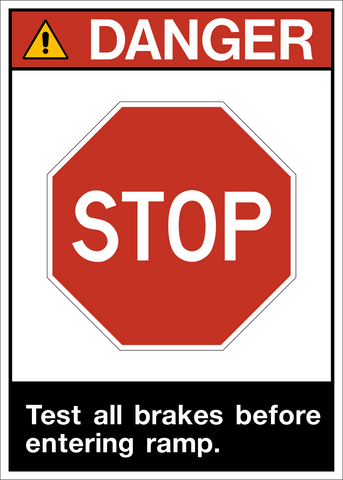 A warning sign with a red 'STOP' sign on a yellow background and text that reads 'DANGER Test all brakes before entering ramp.'.