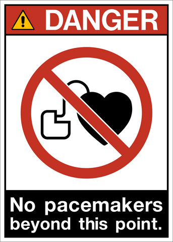 A warning sign with a red and white border and a pictogram that indicates no pacemakers beyond this point.
