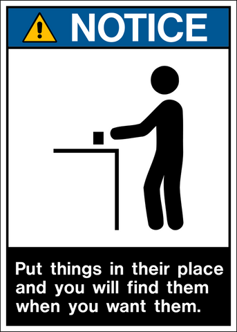 A black and white safety sign with a yellow warning triangle, text, and a pictogram of a person putting things away.