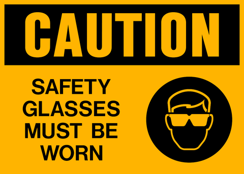 A safety sign with a yellow background and black and yellow text that reads 'CAUTION SAFETY GLASSES MUST BE WORN' along with a pictogram of a person wearing safety glasses.