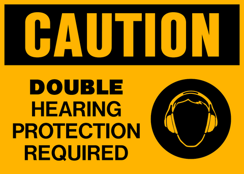 Safety sign with a yellow background and black text that reads 'CAUTION DOUBLE HEARING PROTECTION REQUIRED' along with a pictogram of headphones indicating the need for hearing protection.