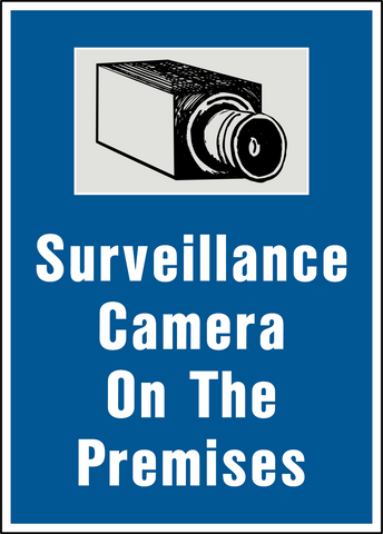 A sign with a white background and a black and white pictogram of a surveillance camera above the text 'SURVEILLANCE CAMERA ON THE PREMISES'.