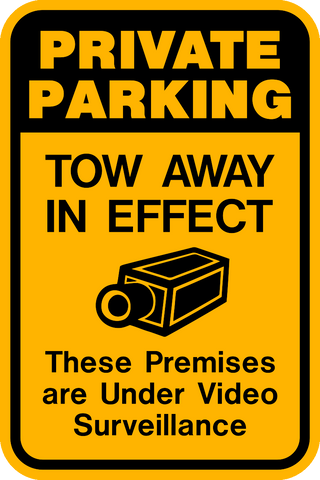 A yellow sign with black text and icon indicating 'PRIVATE PARKING TOW AWAY IN EFFECT These Premises are UNDER VIDEO SURVEILLANCE' along with an image of a camera.