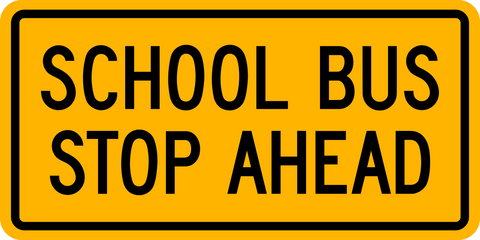 School Bus stop ahead tab warning traffic sign. A rectangle shaped sign with black text on a high intensity prismatic reflective yellow background